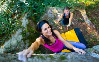 adventurer climbing a rock